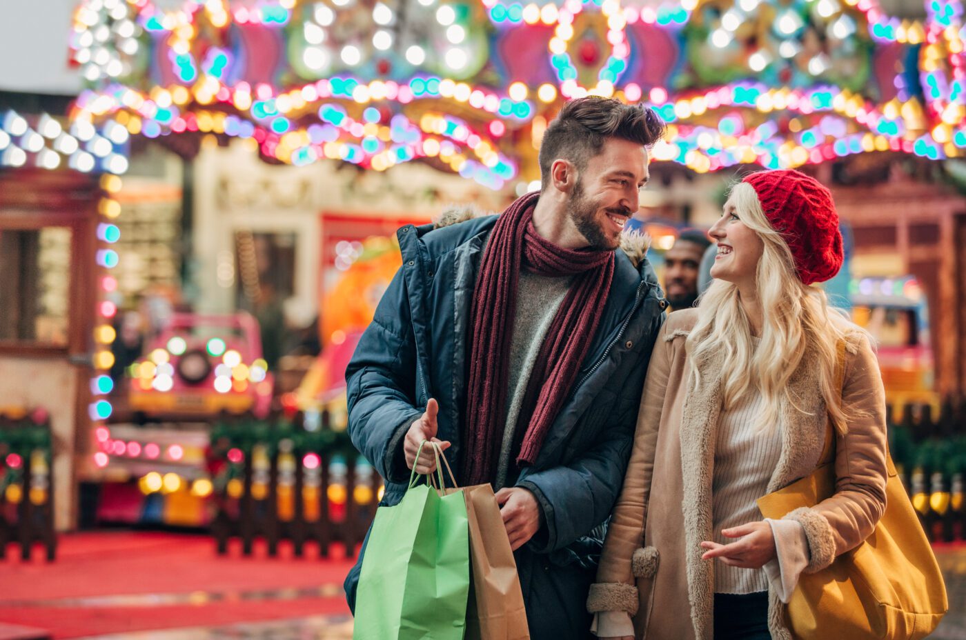 Couple Enjoying Christmas market at Winter Wonderland Cardiff whilst staying at Sleeperz Cardiff.